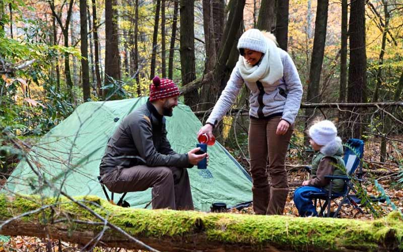 man setting up camp with his kids, camping trip, September 2024, Australia