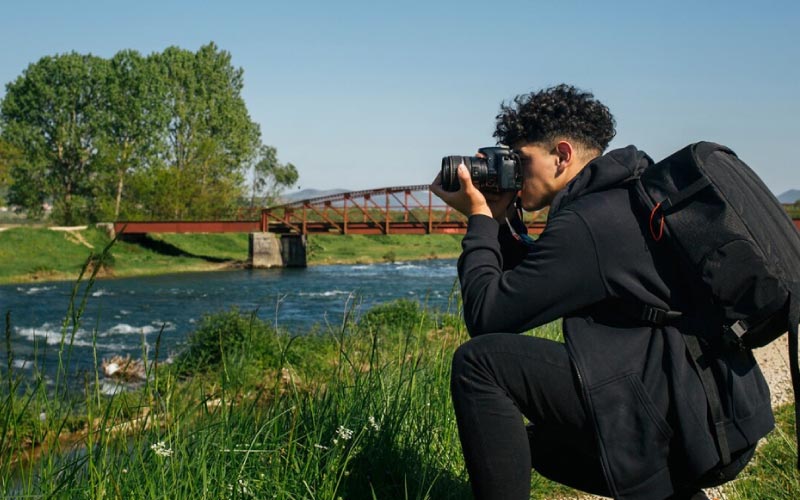 man taking photos of a flock of birds, birdwatching trip, August 2024, Australia