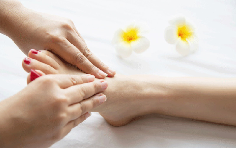 woman receiving a foot massage, summer travel, November 2024, Australia