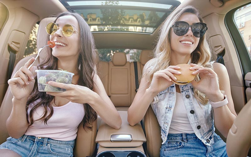 friends snacking in the vehicle, Australian food, January 2024, Australia